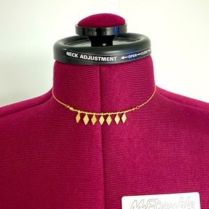 Set of 3 gold coloured chokers